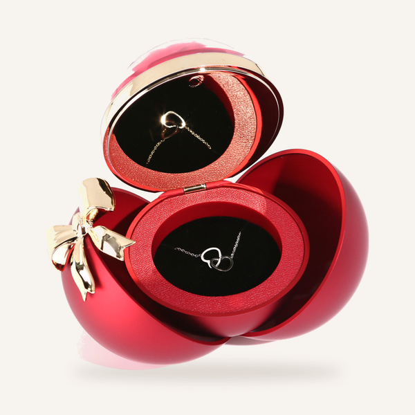 Magnetic heart necklace with two halves that join together