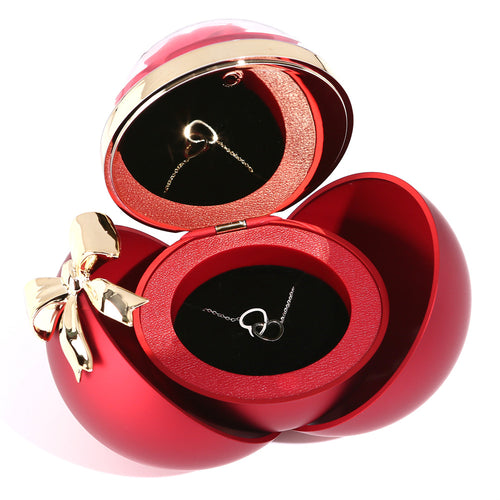Magnetic heart necklace with two halves that join together