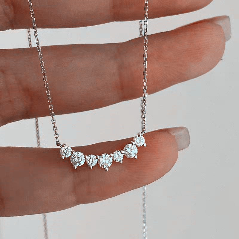 Smile curve necklace shown in its gift box