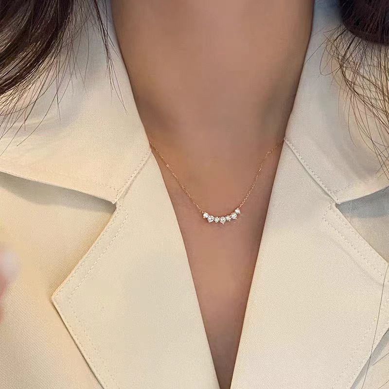 Close-up of the smile curve pendant and stones